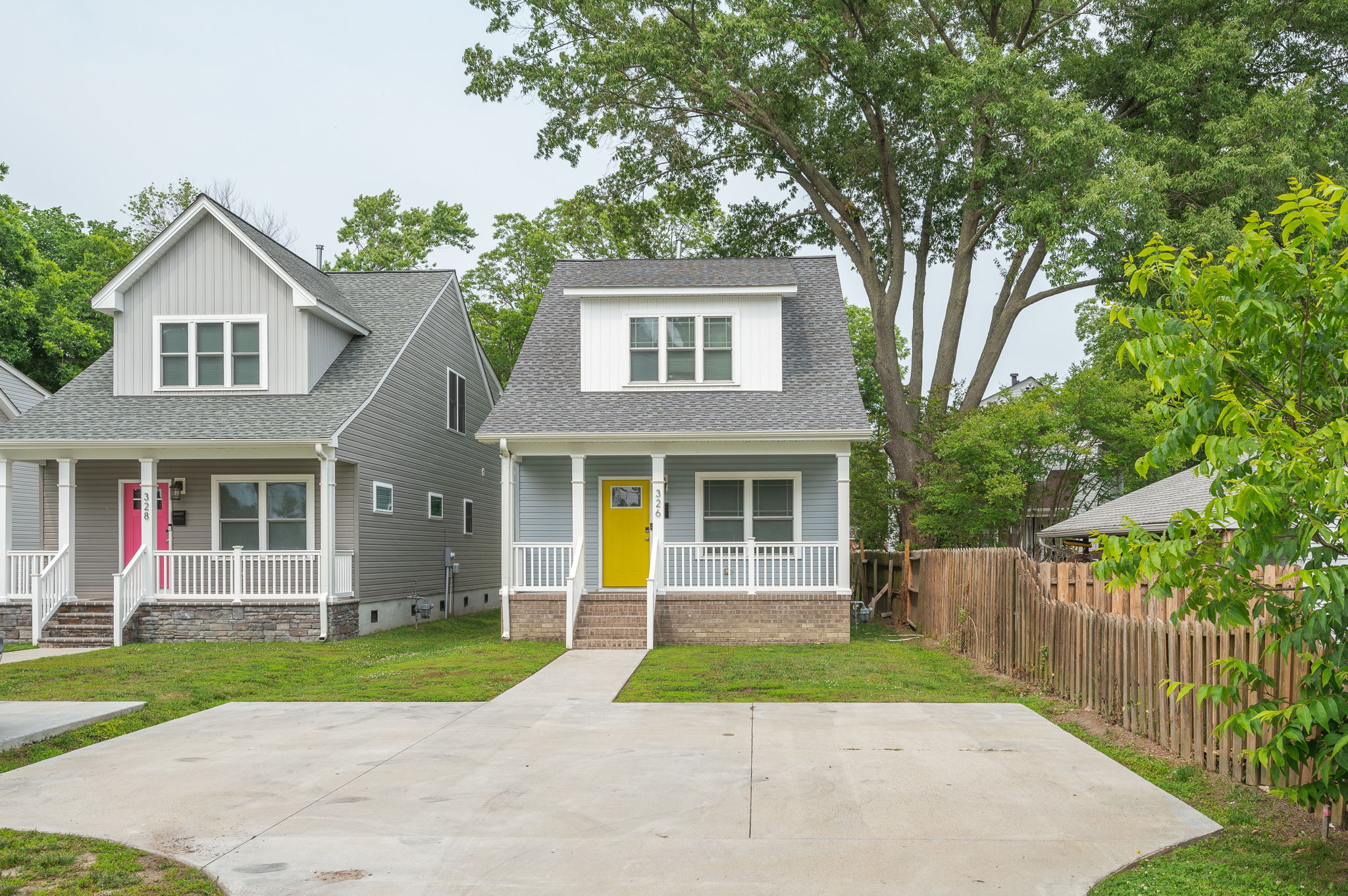 Street view of 326 Atlantic Ave showcasing the house and neighboring properties.