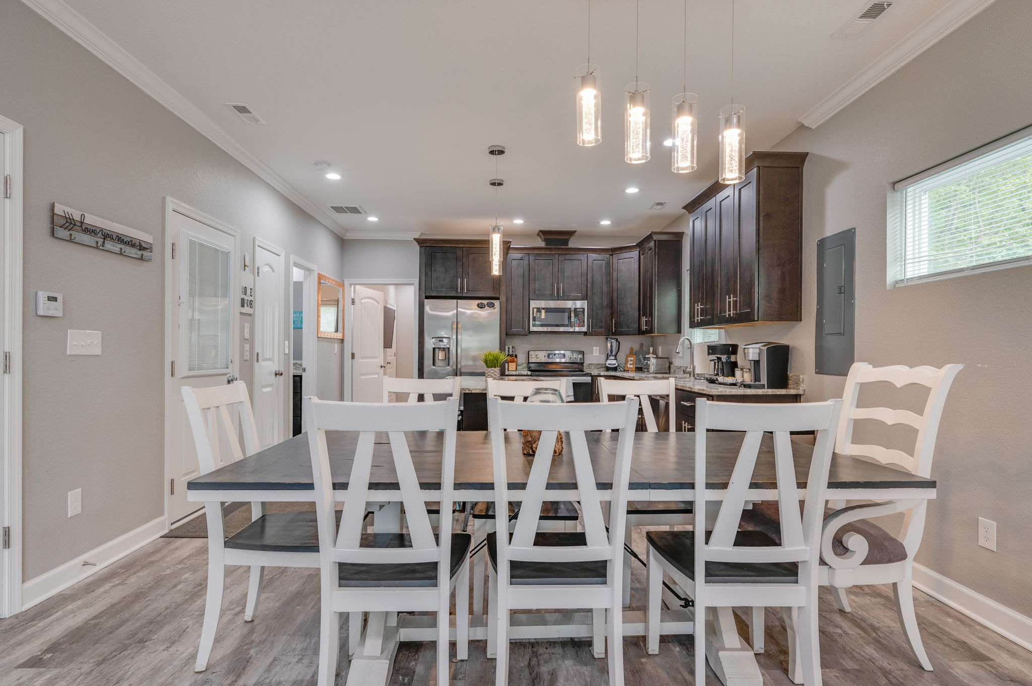 Dining area with seating for eight, adjacent to the kitchen at 326 Atlantic Ave.