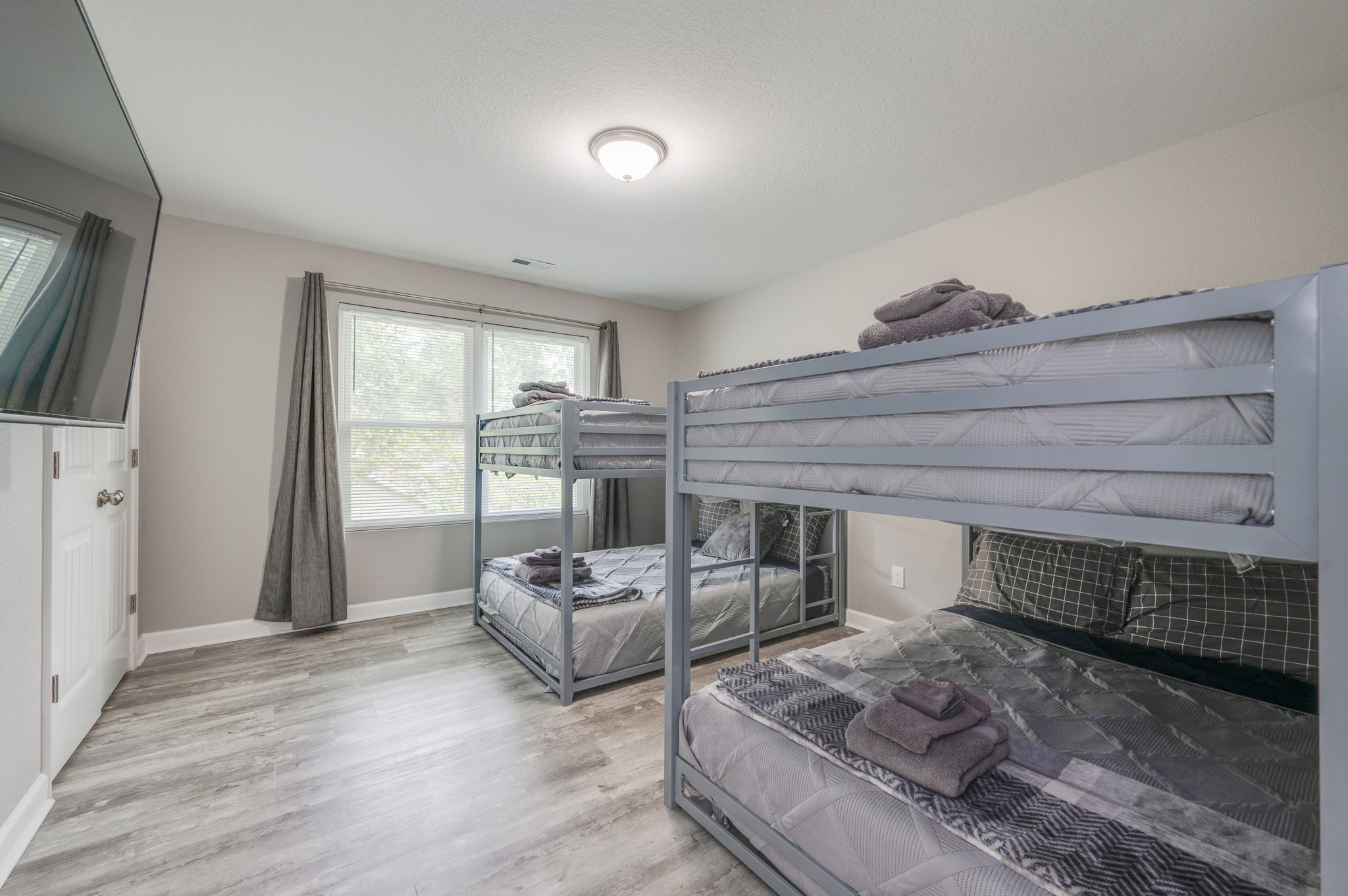 Second guest bedroom with queen-size bed and stylish decor.