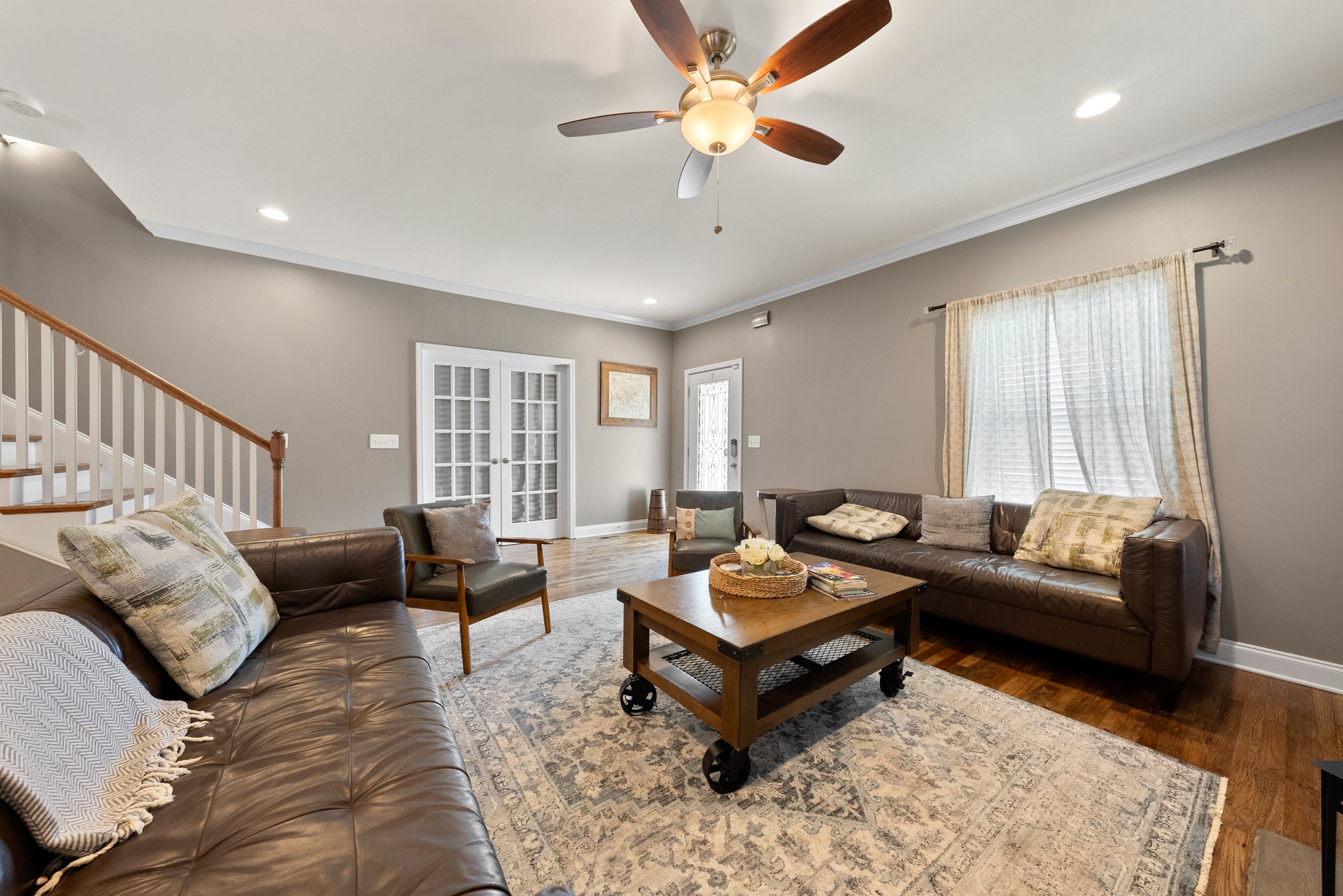 Living room view with French doors leading to the sitting room