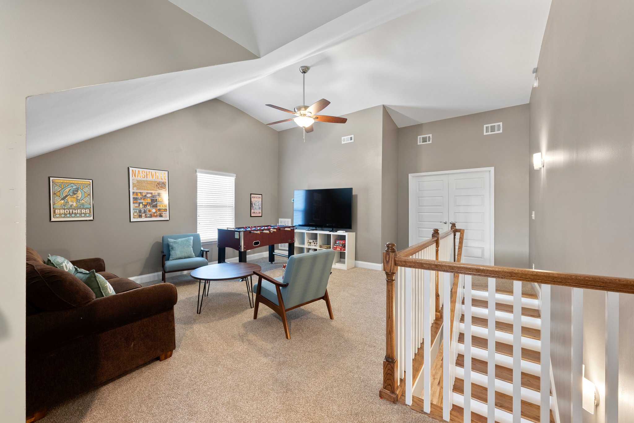 Upstairs family room with TV and foosball table