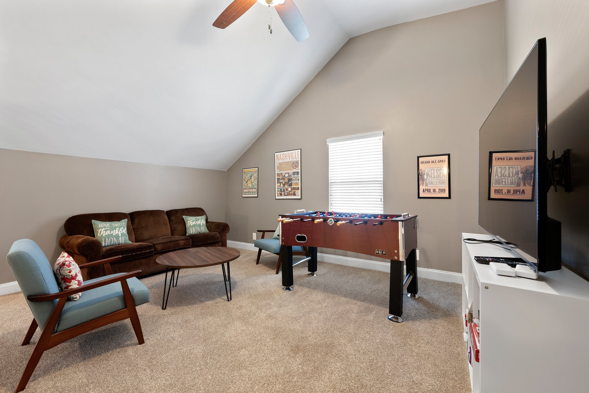 Game room with seating and wall-mounted TV