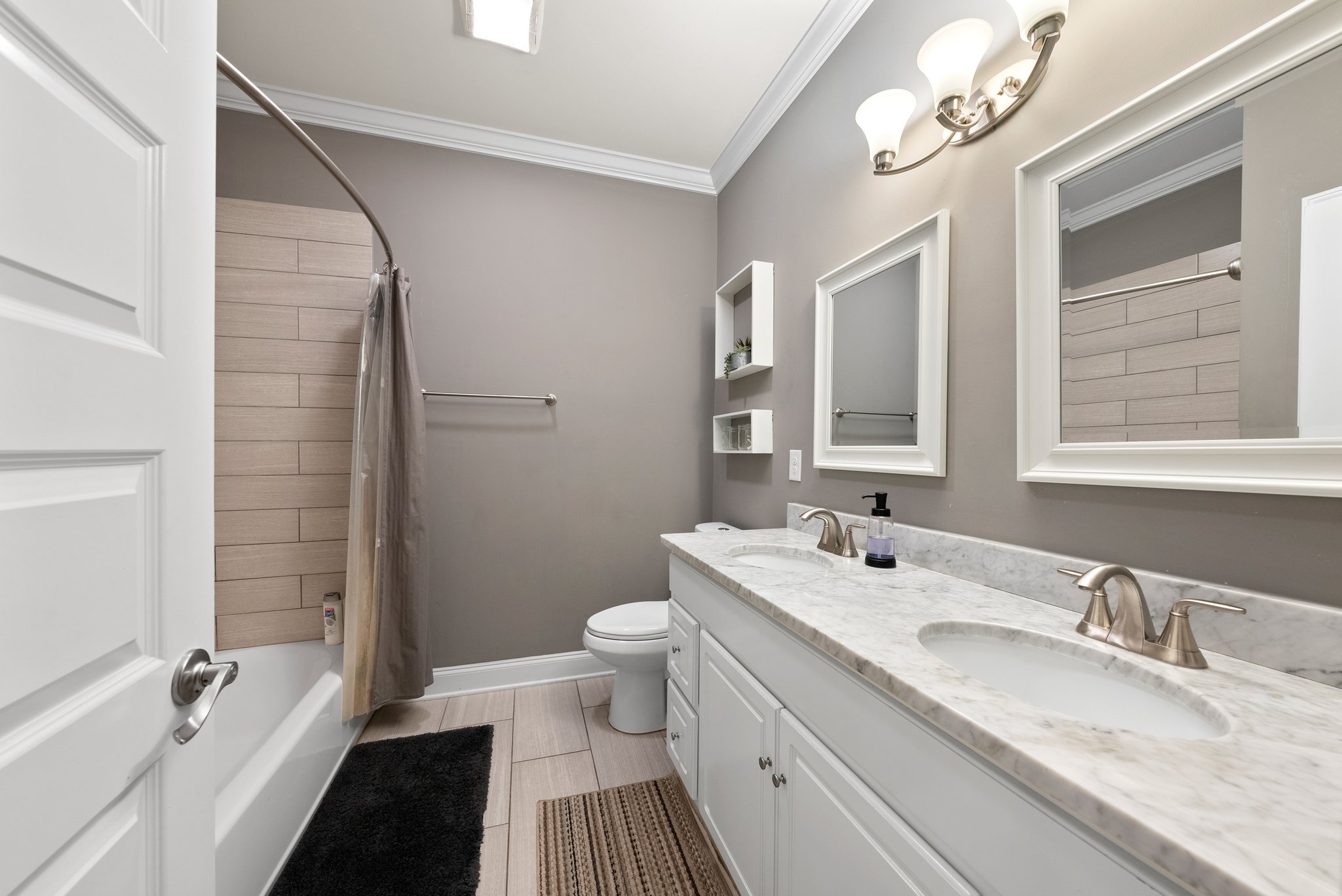 Modern bathroom with double vanity and marble countertop